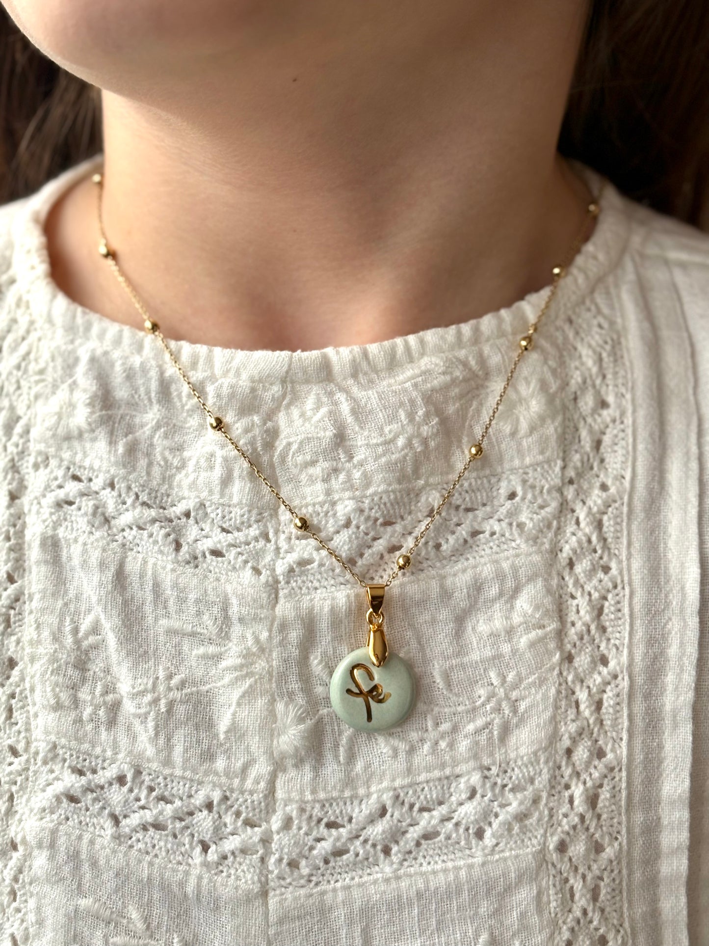 Medalla Fe chica ceramica oro